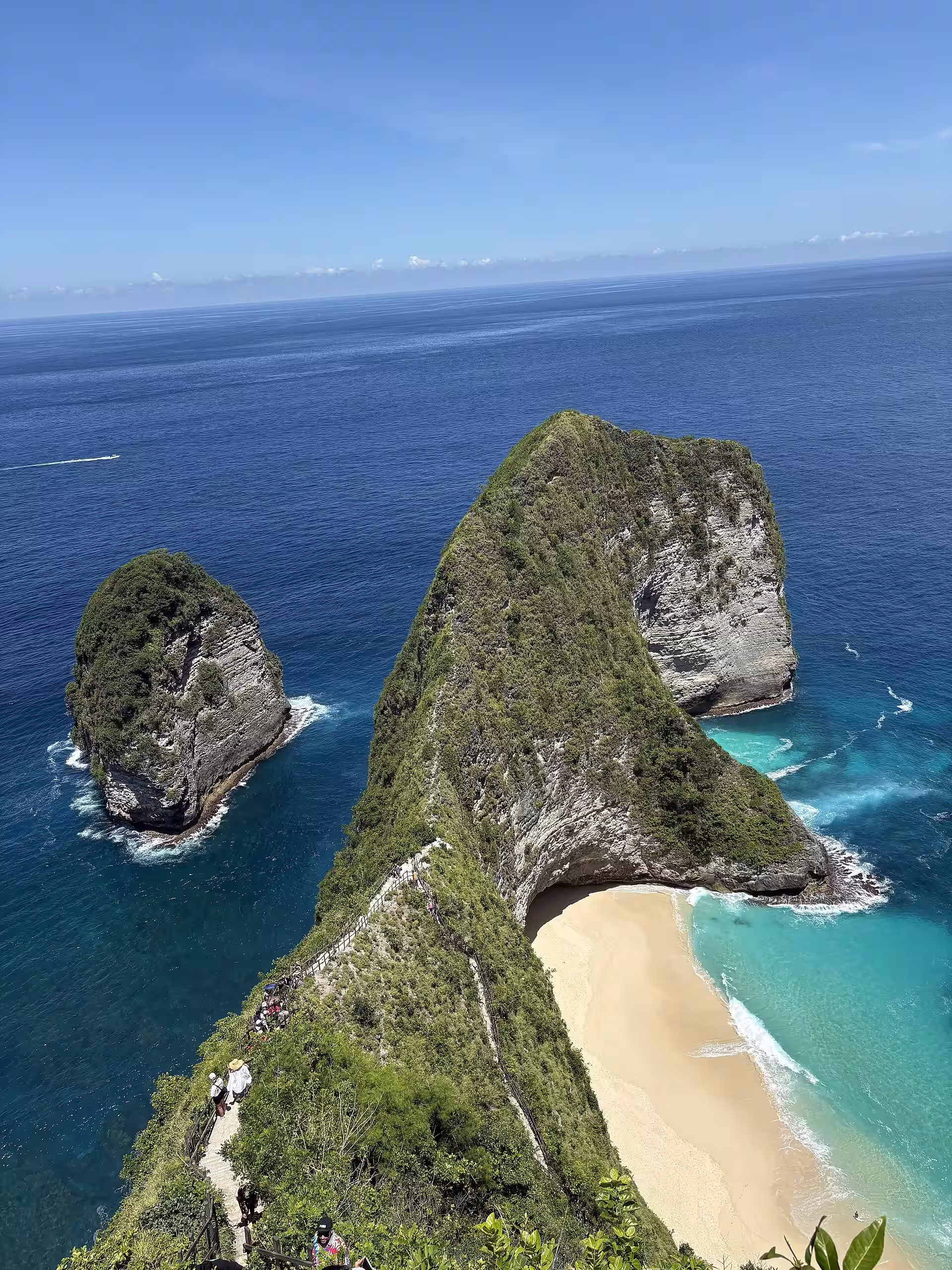 Narrow limestone Kelingking headland with a small offshore rock islet
