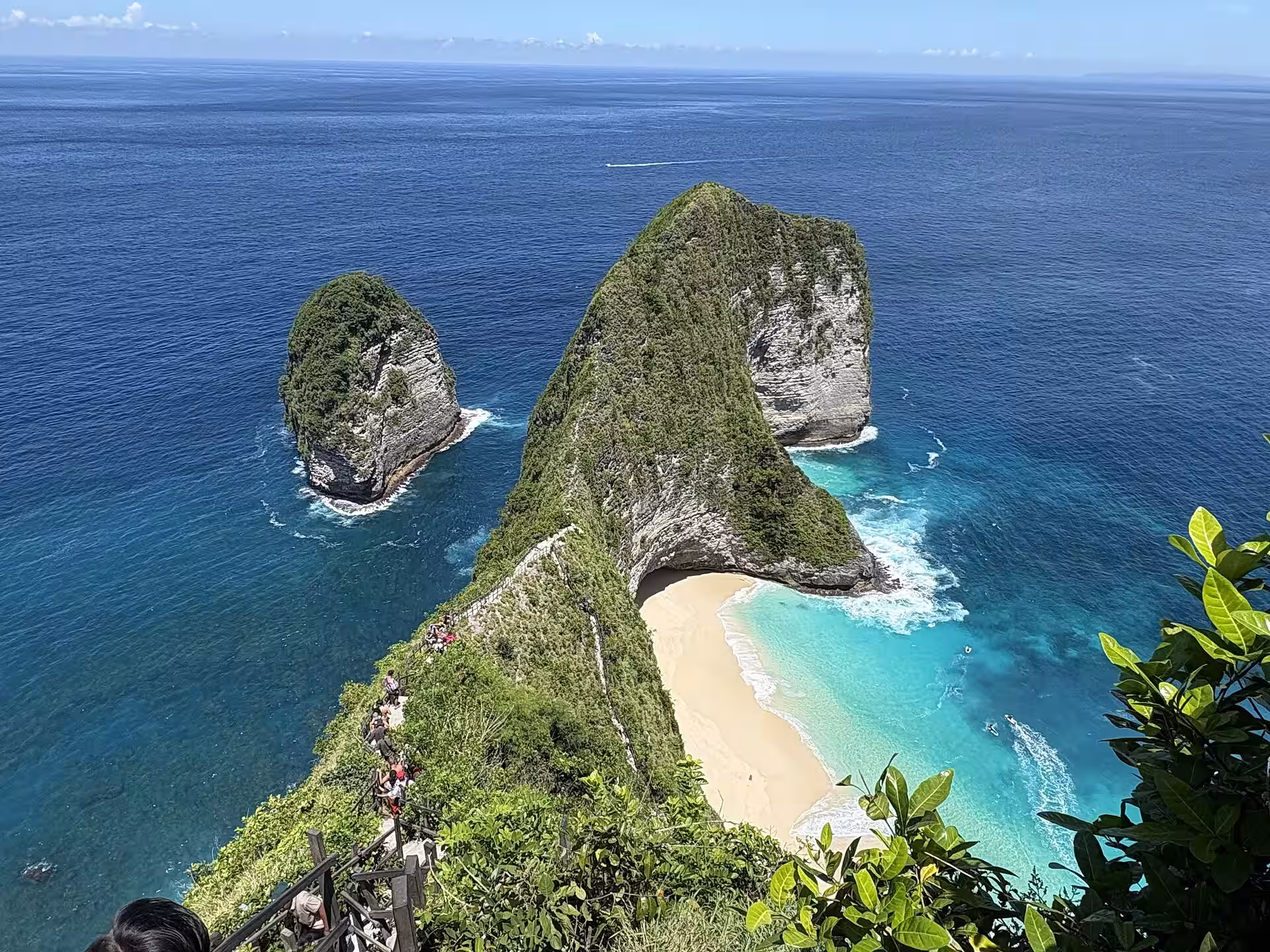 Layered limestone cliffs along Nusa Penida's west coast beside Kelingking headland